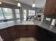 Kitchen featuring a large island, granite countertops, and modern appliances at 3806 Sycamore Bend S Way, Columbus, IN 47203
