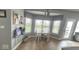 Bright breakfast nook with a table and chairs, surrounded by three windows at 3806 Sycamore Bend S Way, Columbus, IN 47203