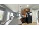 Open kitchen featuring gray counters, black appliances and a view of the living room at 3806 Sycamore Bend S Way, Columbus, IN 47203