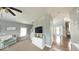 Bright living room with staircase, console, and view of the front door at 3806 Sycamore Bend S Way, Columbus, IN 47203
