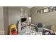 A well-organized playroom featuring toys, a patterned rug and a recliner at 3806 Sycamore Bend S Way, Columbus, IN 47203