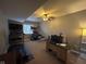 Carpeted recreation room with a TV, desk and basketball game at 3806 Sycamore Bend S Way, Columbus, IN 47203