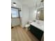 Stylish bathroom features updated vanity, shower, and fixtures at 439 Pleasantview Dr, Greenwood, IN 46142