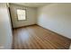 Bedroom featuring wood-look floors and a window view at 439 Pleasantview Dr, Greenwood, IN 46142