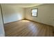 Bright bedroom featuring wood-look floors and a sunny window at 439 Pleasantview Dr, Greenwood, IN 46142
