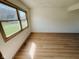 Bright bedroom showcasing wood floors, natural light, and a tranquil view at 439 Pleasantview Dr, Greenwood, IN 46142