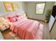Bright bedroom featuring a pink theme, soft textures, and natural lighting at 439 Pleasantview Dr, Greenwood, IN 46142