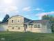 Charming two-story home with a well-maintained lawn and attached garage at 439 Pleasantview Dr, Greenwood, IN 46142