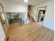 Inviting foyer with wood floors, staircase, and views into the living room and kitchen at 439 Pleasantview Dr, Greenwood, IN 46142