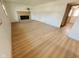 Bright living room showcasing beautiful wood floors and an inviting brick fireplace at 439 Pleasantview Dr, Greenwood, IN 46142