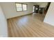 Bright living room featuring wood floors, natural light, and views of the front yard at 439 Pleasantview Dr, Greenwood, IN 46142