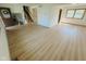 Open-concept living area with wood floors, staircase, and large windows for ample light at 439 Pleasantview Dr, Greenwood, IN 46142