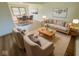 Bright living room featuring stylish neutral-toned furnishings and an adjacent dining area at 439 Pleasantview Dr, Greenwood, IN 46142