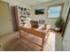 Inviting home office featuring a large desk, bookshelf, and natural light at 439 Pleasantview Dr, Greenwood, IN 46142