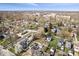 Aerial view showcases a charming residential neighborhood with mature trees, green spaces, and various architectural styles at 4711 Cornelius Ave, Indianapolis, IN 46208