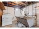Unfinished basement area featuring washer/dryer hookup and utility sink at 4711 Cornelius Ave, Indianapolis, IN 46208