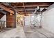 Unfinished basement area featuring exposed ducts and washer/dryer hookup at 4711 Cornelius Ave, Indianapolis, IN 46208