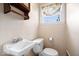 Bathroom with sink and toilet, featuring natural light from the window at 4711 Cornelius Ave, Indianapolis, IN 46208