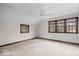 Bedroom with neutral walls, carpet, and natural light from three windows at 4711 Cornelius Ave, Indianapolis, IN 46208