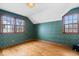 Bedroom with hardwood floors, decorative wallpaper and natural light from the windows at 4711 Cornelius Ave, Indianapolis, IN 46208