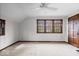 Bright bedroom with neutral carpet, ceiling fan, and natural light from large windows at 4711 Cornelius Ave, Indianapolis, IN 46208