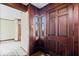 Front door and entryway featuring wood trim and vintage charm at 4711 Cornelius Ave, Indianapolis, IN 46208