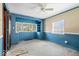 Living room featuring built-in shelving, a ceiling fan, and a neutral carpet at 4711 Cornelius Ave, Indianapolis, IN 46208