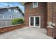 A back patio with a brick retaining wall at 4720 Central Ave, Indianapolis, IN 46205