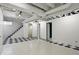 Spacious basement with checkered floors, painted white walls, and exposed ceiling at 4720 Central Ave, Indianapolis, IN 46205