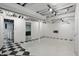 Finished basement with white walls, track lighting and laundry hookups at 4720 Central Ave, Indianapolis, IN 46205