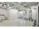 Finished basement featuring checkered flooring, utility access, and painted white walls at 4720 Central Ave, Indianapolis, IN 46205