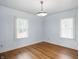 Bright bedroom featuring hardwood floors and windows that bring in plenty of natural light at 4720 Central Ave, Indianapolis, IN 46205