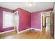 Charming bedroom featuring a window for natural light and beautiful hardwood floors at 4720 Central Ave, Indianapolis, IN 46205