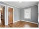 Inviting bedroom with hardwood floors, ample natural light and a convenient closet at 4720 Central Ave, Indianapolis, IN 46205