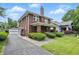 Beautiful brick home with an attached garage and well-maintained landscaping at 4720 Central Ave, Indianapolis, IN 46205