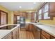 Updated kitchen boasts stainless appliances, sleek countertops, wood cabinets, and center island at 4720 Central Ave, Indianapolis, IN 46205