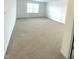 Spacious bedroom with neutral carpet and multiple windows for natural light at 5115 Triple Crown Way, Indianapolis, IN 46237