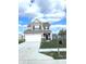 Traditional two-story home with a two-car garage, features a well-maintained lawn and classic black shutters at 5115 Triple Crown Way, Indianapolis, IN 46237