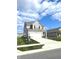 Charming two-story home features neutral siding, black shutters and a two-car garage, set on a well-maintained lawn at 5115 Triple Crown Way, Indianapolis, IN 46237