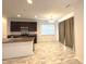 Kitchen boasts modern appliances and flows seamlessly into the dining area at 5115 Triple Crown Way, Indianapolis, IN 46237