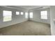 Light-filled bedroom boasts large windows and plush carpeting at 5115 Triple Crown Way, Indianapolis, IN 46237