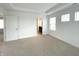 Spacious main bedroom with neutral carpet and ensuite bathroom at 5115 Triple Crown Way, Indianapolis, IN 46237