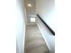 Carpeted stairs lead to a bright upper level at 5115 Triple Crown Way, Indianapolis, IN 46237