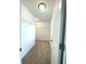 Walk-in closet with shelving and neutral colored carpet at 5115 Triple Crown Way, Indianapolis, IN 46237