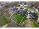 Aerial view of a home showcasing its sprawling yard and neighborhood surroundings at 5202 Logan Ln, Indianapolis, IN 46250