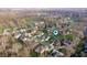Aerial view of a residential neighborhood showcasing well-maintained houses and tree-lined streets at 5202 Logan Ln, Indianapolis, IN 46250