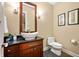 Bathroom featuring single vanity with granite countertops and modern fixtures at 5202 Logan Ln, Indianapolis, IN 46250