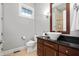 Bathroom featuring single vanity with granite countertops and modern fixtures at 5202 Logan Ln, Indianapolis, IN 46250