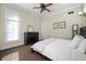 Bedroom with neutral walls, a ceiling fan, and a window offering natural light at 5202 Logan Ln, Indianapolis, IN 46250