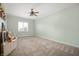 Cozy bedroom with neutral color scheme and a ceiling fan for added comfort at 5202 Logan Ln, Indianapolis, IN 46250